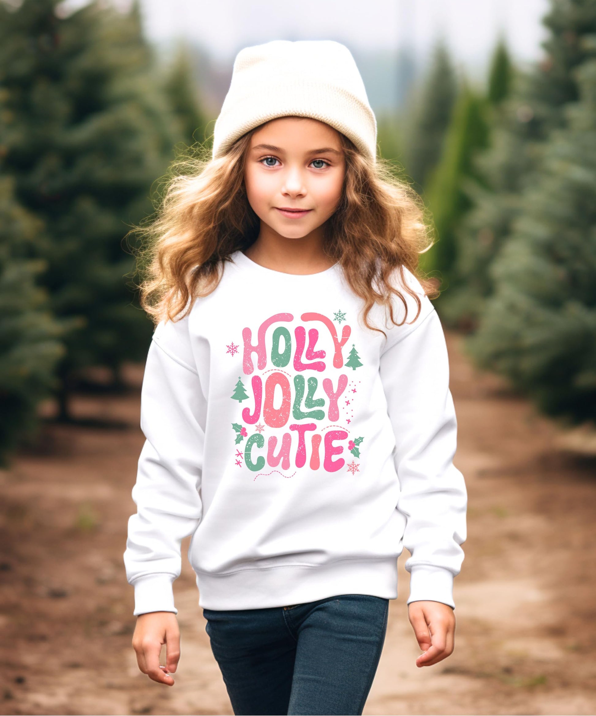 Flat lay of black girls Christmas sweatshirt featuring Holly Jolly Cutie holiday graphic