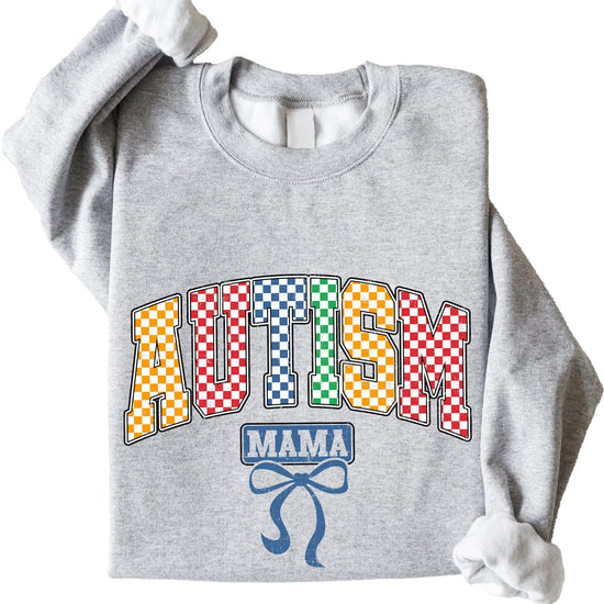 Model wearing colorful checkered Autism Mama sweatshirt, casual lifestyle shot