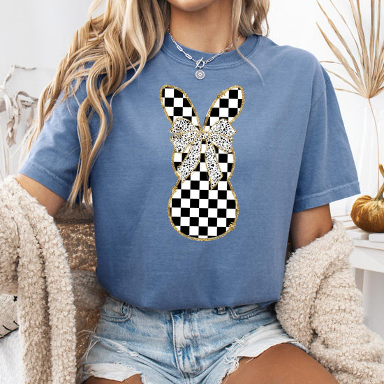 Detail shot of retro checkered bunny design print on shirt