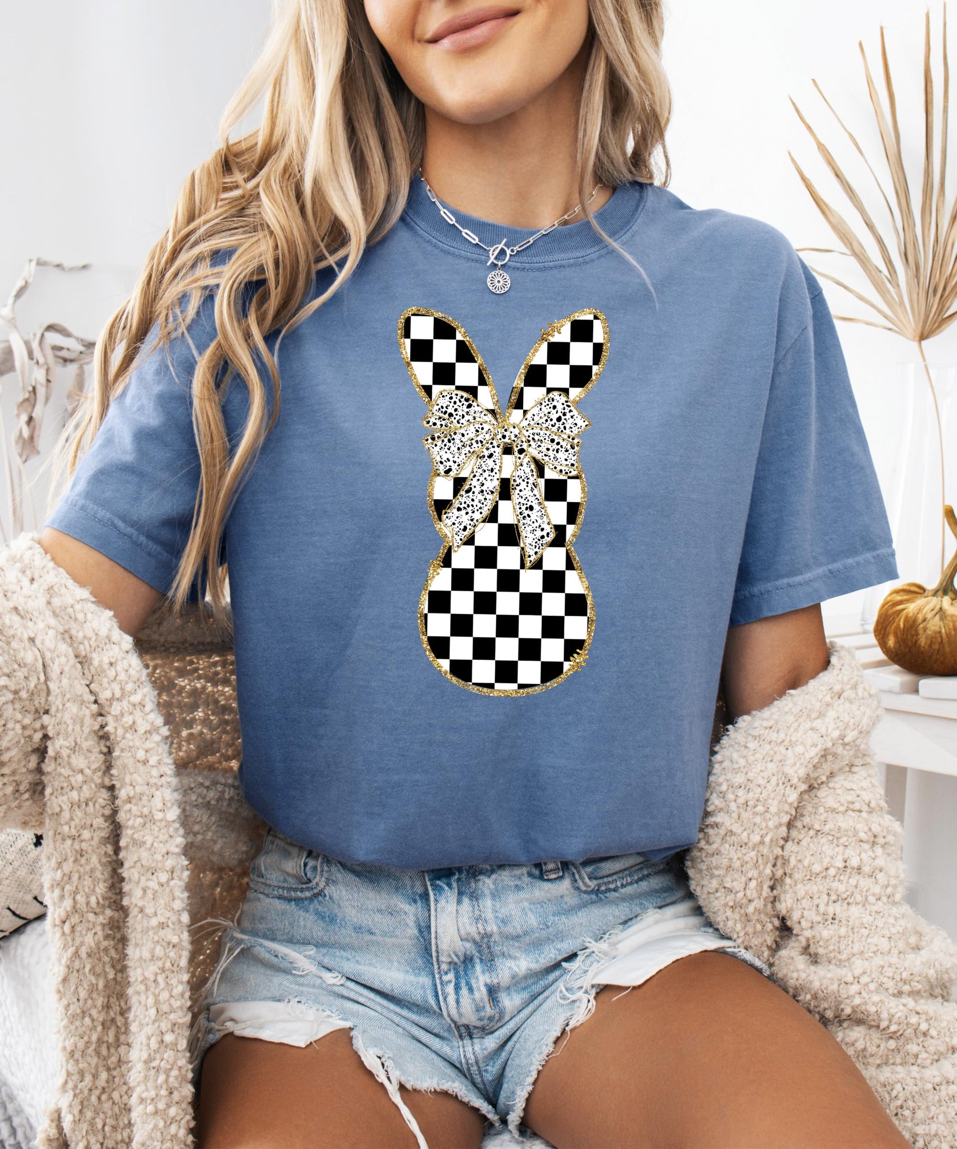 Detail shot of retro checkered bunny design print on shirt