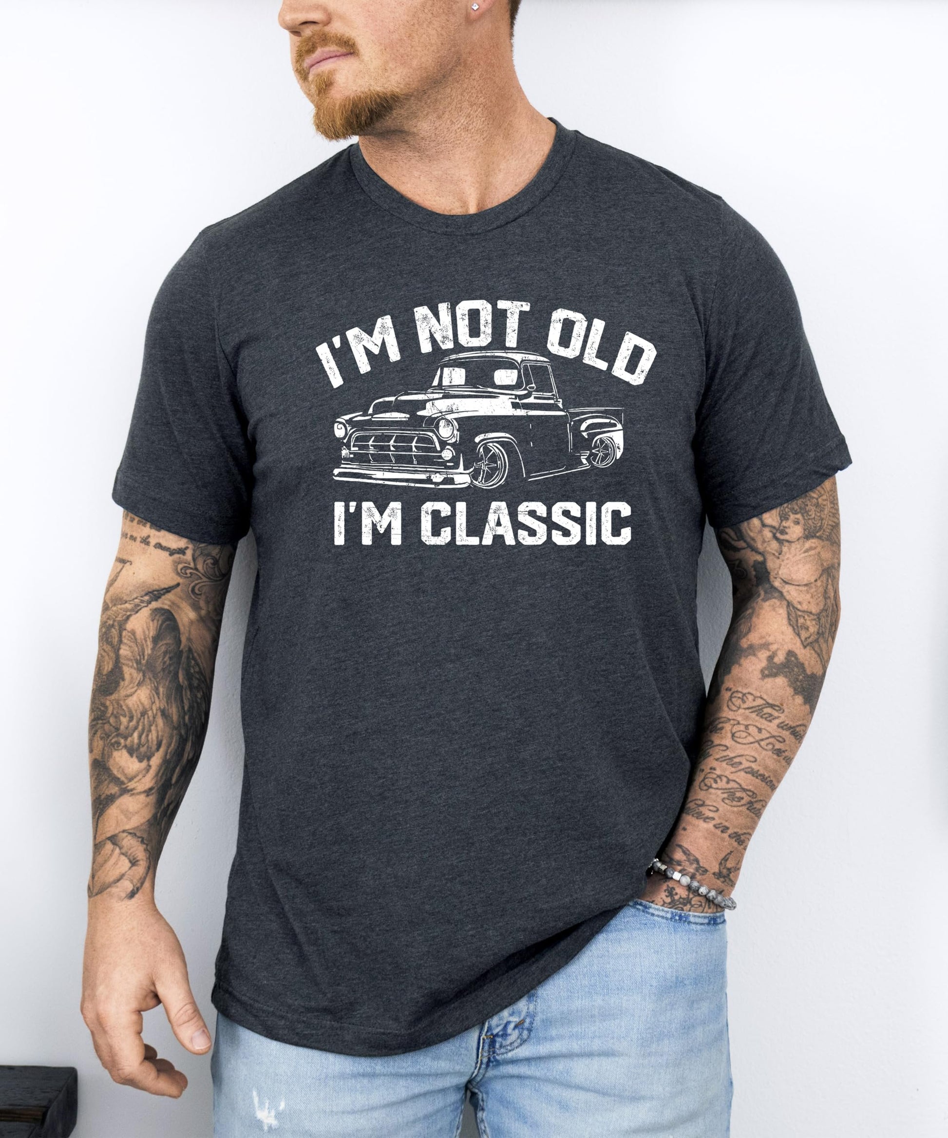 Lifestyle or detail shot of men's classic car dad joke graphic tee in black