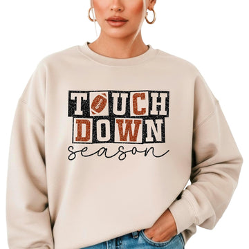 Side view of grey touchdown season sweatshirt showing relaxed fit on model