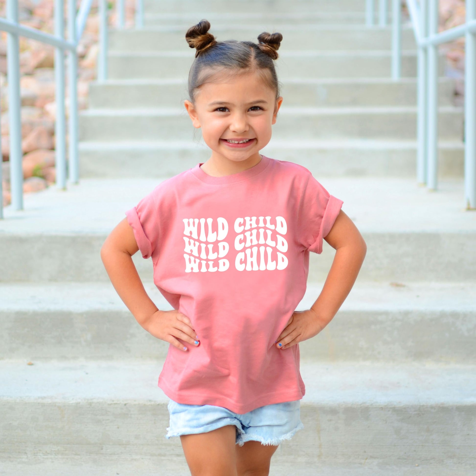 Olive Loves Apple Wild Child baby and toddler shirt in peach with white wavy text design