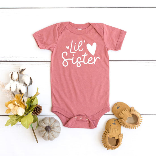 Olive Loves Apple Lil Sister Bodysuit styled for sibling announcement photo