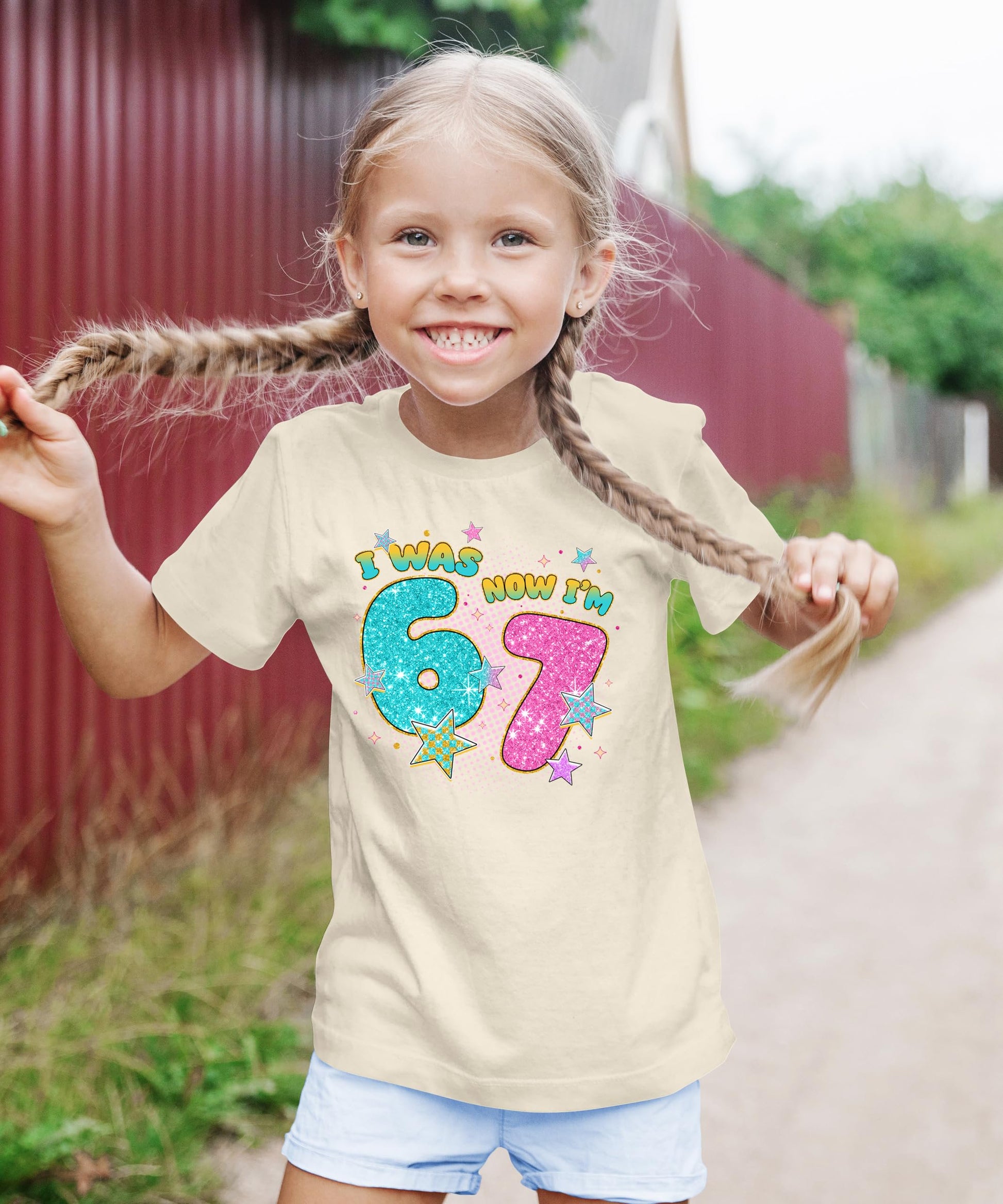 Flat lay of pink girls' birthday shirt with glitter number 7 graphic