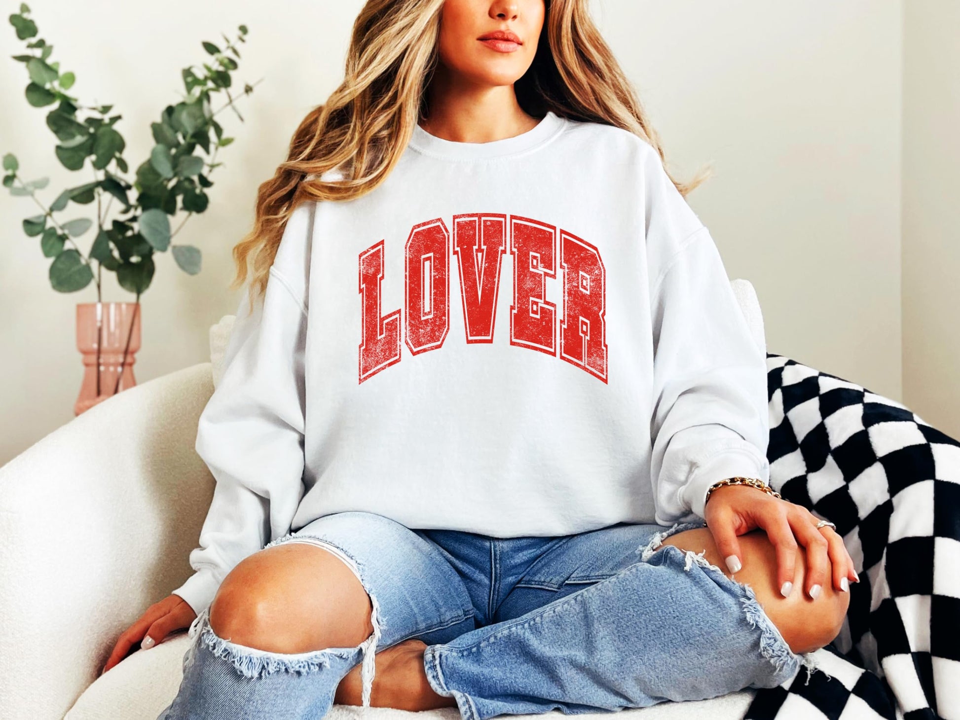 Model wearing red and white Lover varsity sweatshirt for Galentine's Day