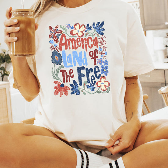America Land of the Free patriotic tee flat lay showing full design and fit