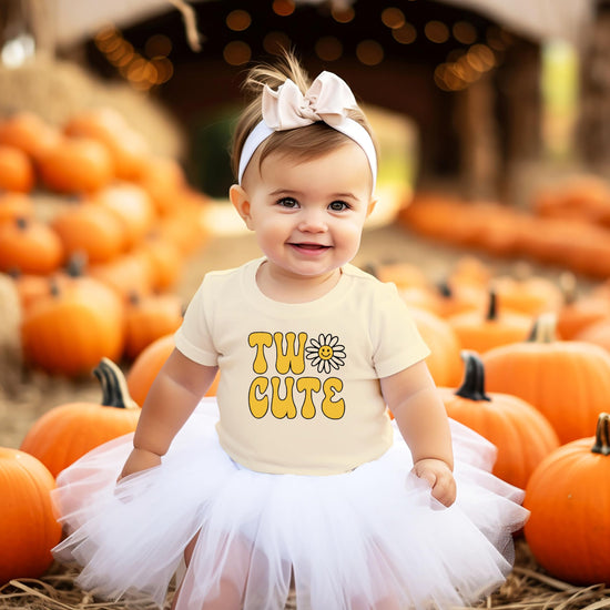 Two Cute birthday shirt detail showing vibrant daisy graphic print for toddler girls