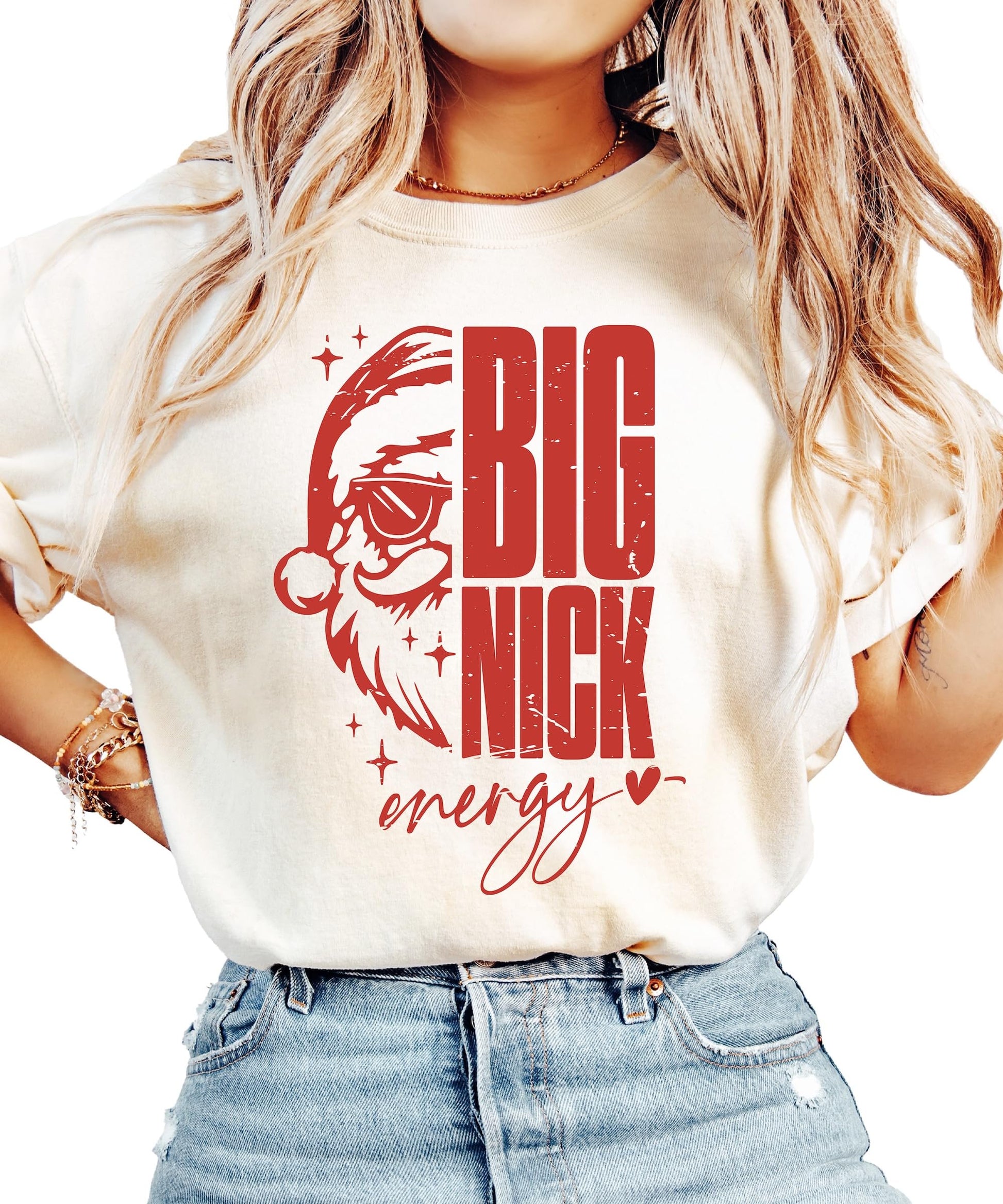 Women's ivory Big Nick Energy Christmas t-shirt with cool Santa wearing sunglasses graphic