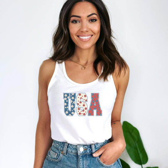 Close-up of patriotic flower graphic on white women's sleeveless tank top