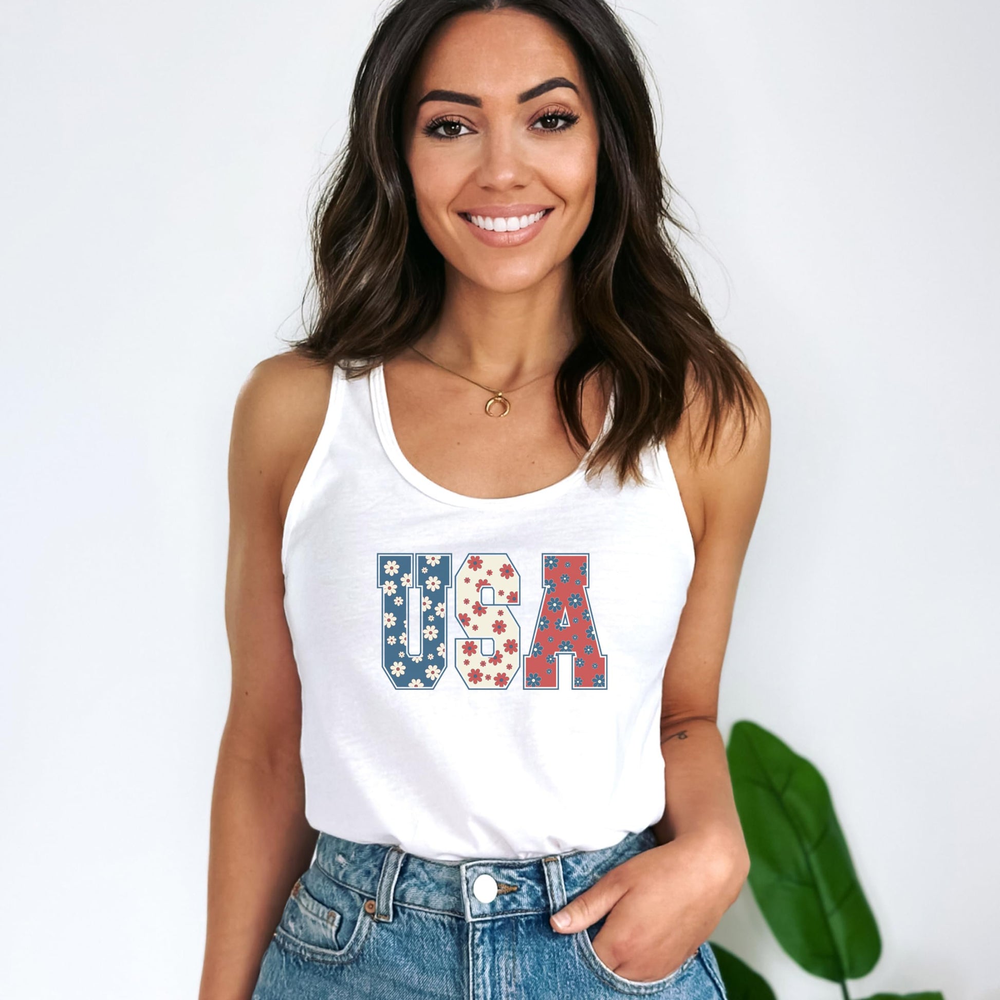 Close-up of patriotic flower graphic on white women's sleeveless tank top