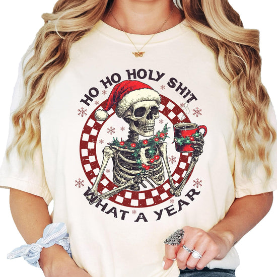 Front view of seafoam green holiday skeleton graphic tee for women and men