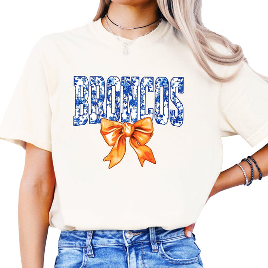 Broncos orange bow graphic tee styled for game day — women's team spirit shirt