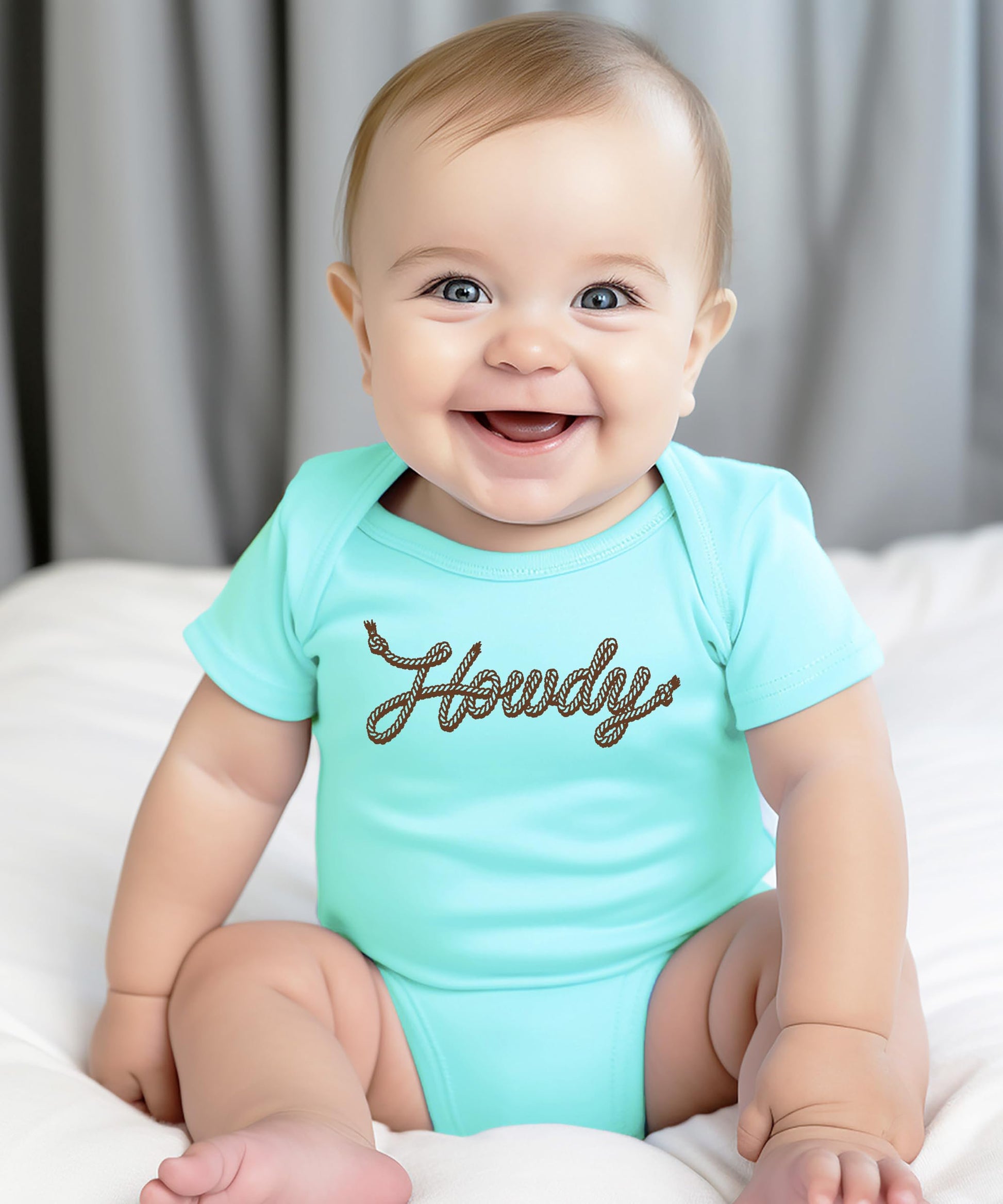 Howdy rope script baby bodysuit displayed on neutral background, gender-neutral country infant outfit