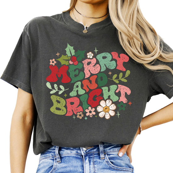 Front view of women's Merry and Bright distressed holiday shirt with festive typography design