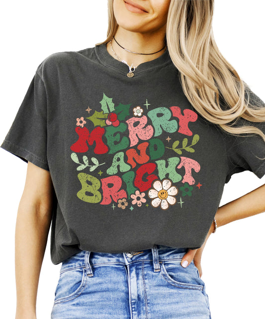 Front view of women's Merry and Bright distressed holiday shirt with festive typography design