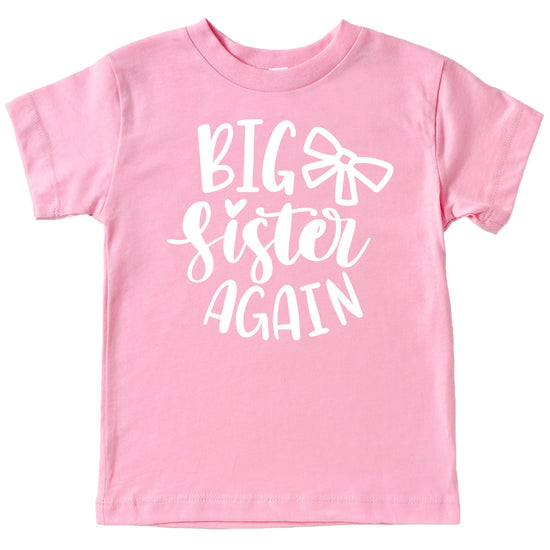 Close-up of Big Sister Again bow print on mauve girls sibling reveal shirt