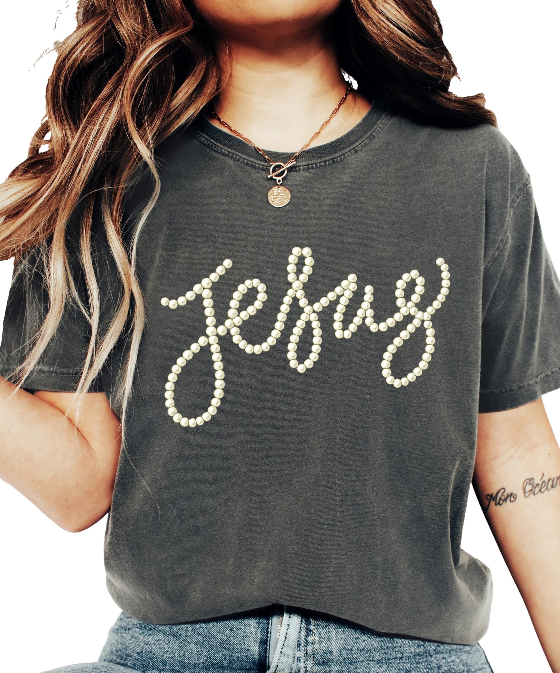 Close-up of pearl script Jesus design on a seafoam women's graphic tee