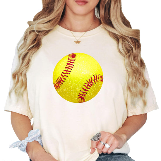 Olive Loves Apple faux glitter softball tee shown styled for game day, women's fit