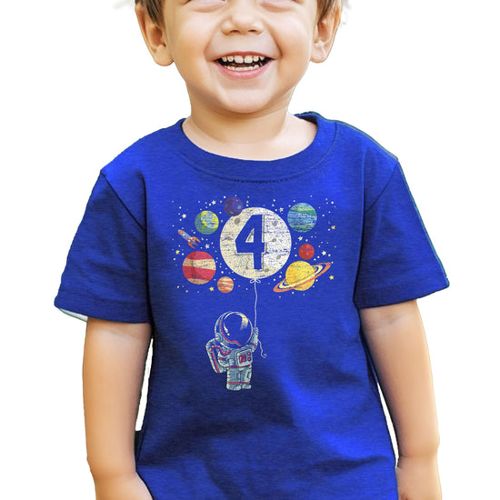 Flat lay of black toddler tee with colorful astronaut rocket and planets birthday graphic