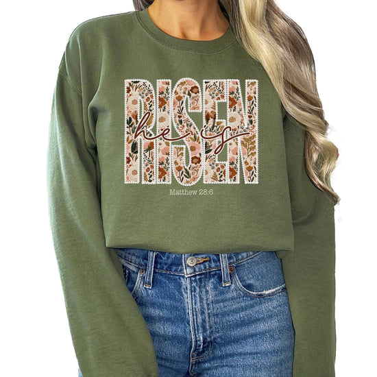 Detail shot of Bible verse Matthew 28:6 graphic on women's Easter faith sweatshirt