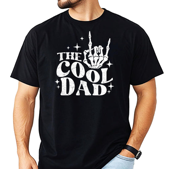 Men's black graphic tee featuring a skeleton hand throwing a rock sign with 'Cool Dad' design