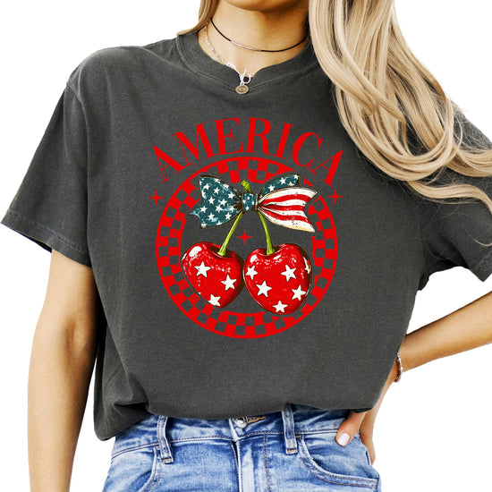 Close-up of red cherry with bow and stars patriotic graphic design
