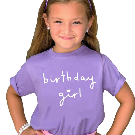 Close-up of Birthday Girl heart graphic print on military green kids t-shirt