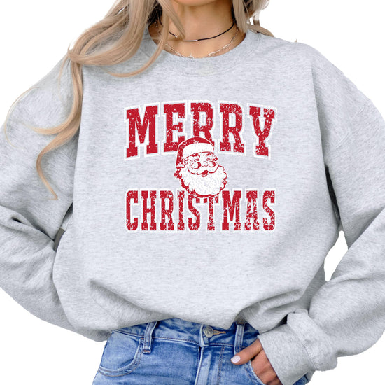 Close-up of vintage Santa graphic with distressed Merry Christmas text on gray sweatshirt