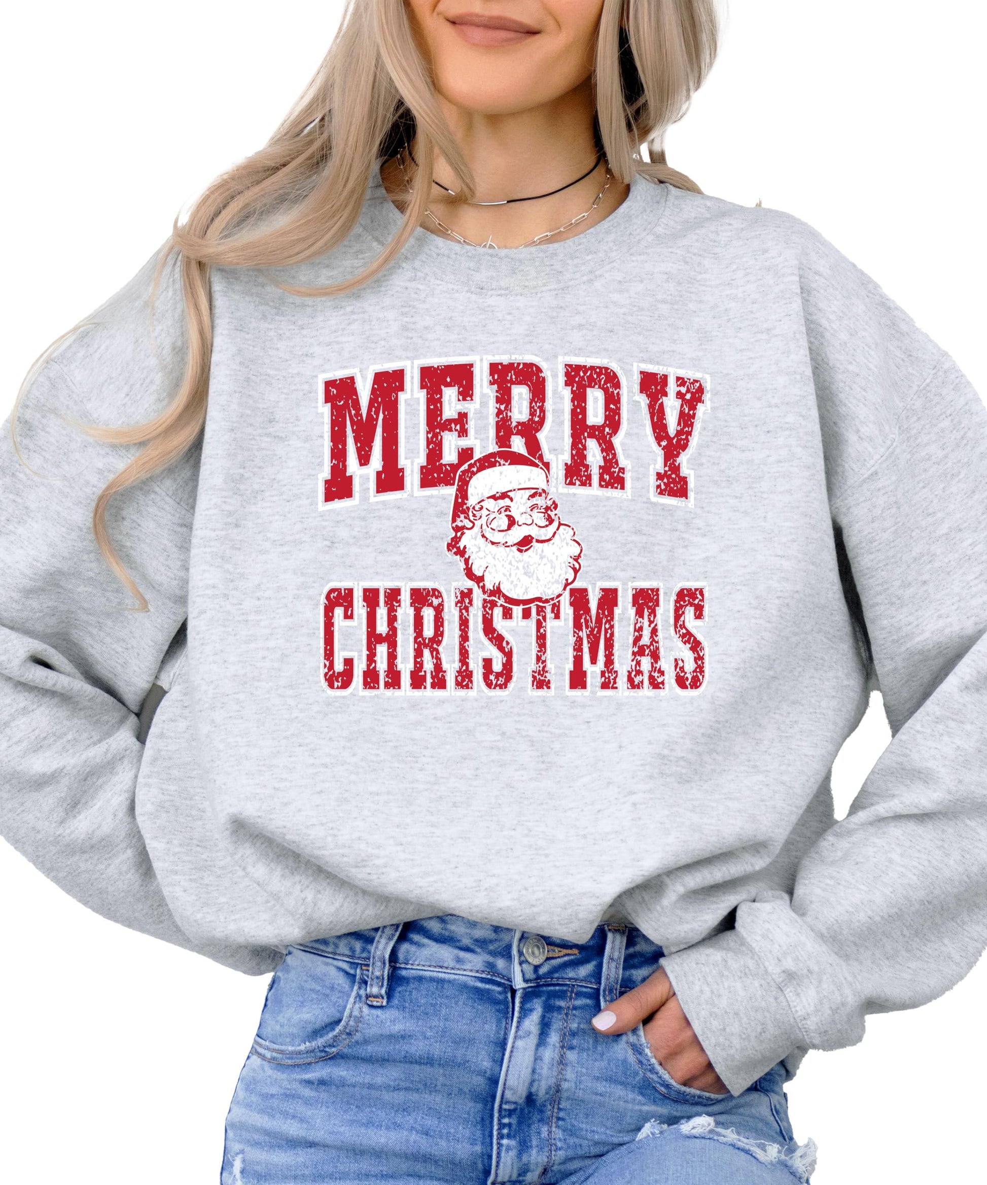 Close-up of vintage Santa graphic with distressed Merry Christmas text on gray sweatshirt