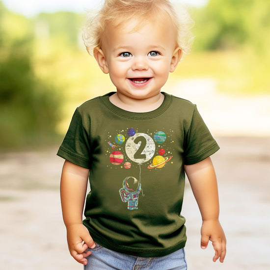 Black toddler tee worn by child featuring colorful outer space rocket birthday graphic