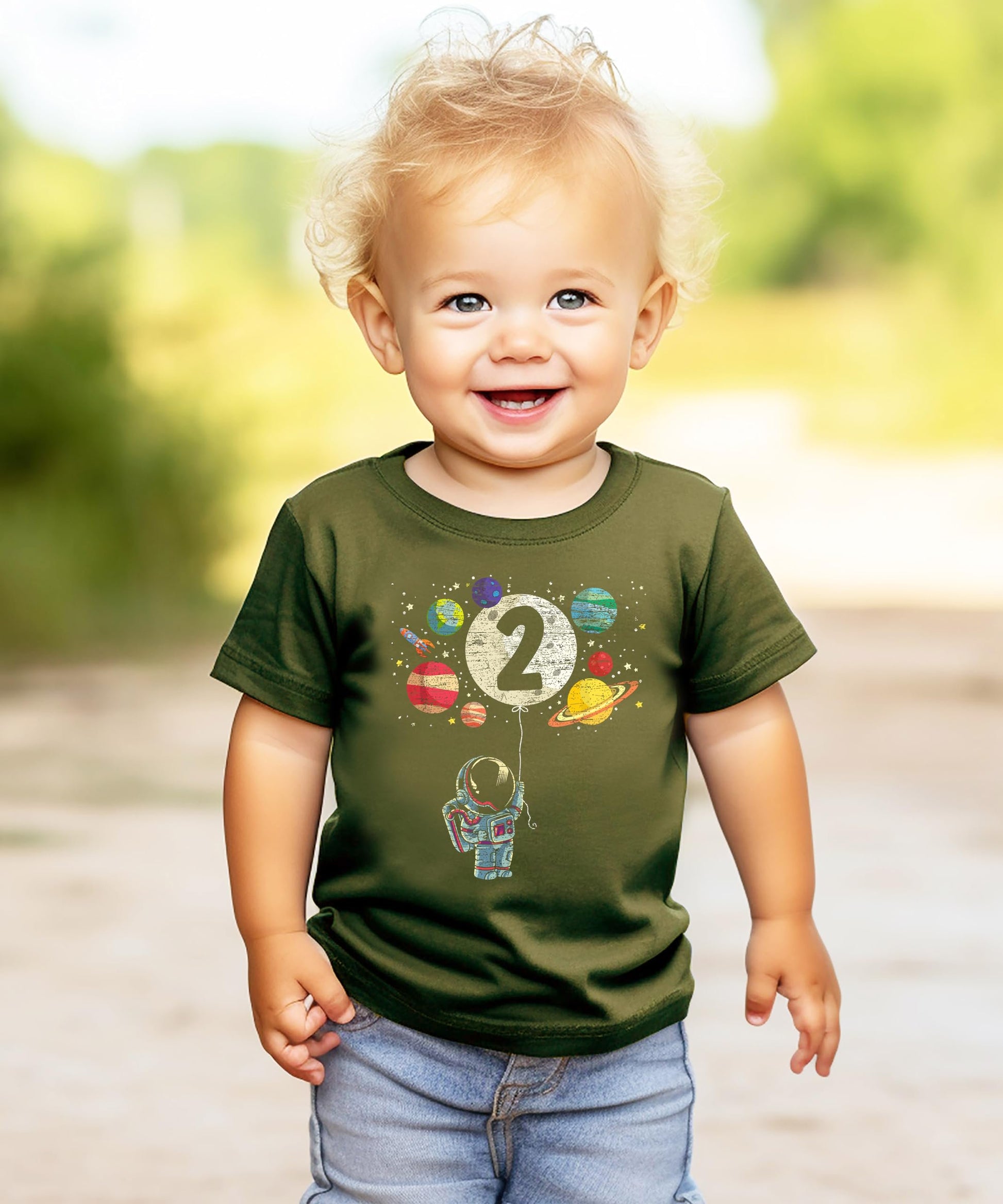 Black toddler tee worn by child featuring colorful outer space rocket birthday graphic
