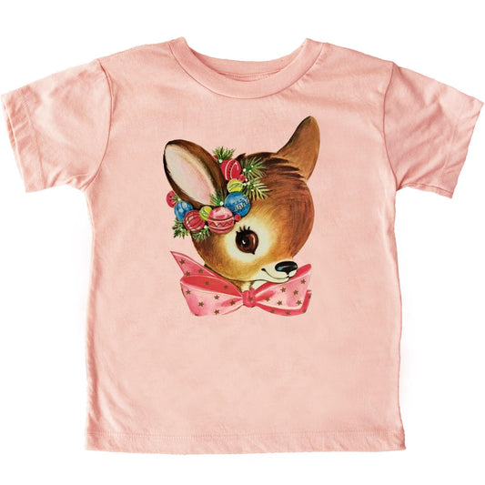 Peach toddler Christmas t-shirt featuring a cute reindeer wreath graphic design by Olive Loves Apple