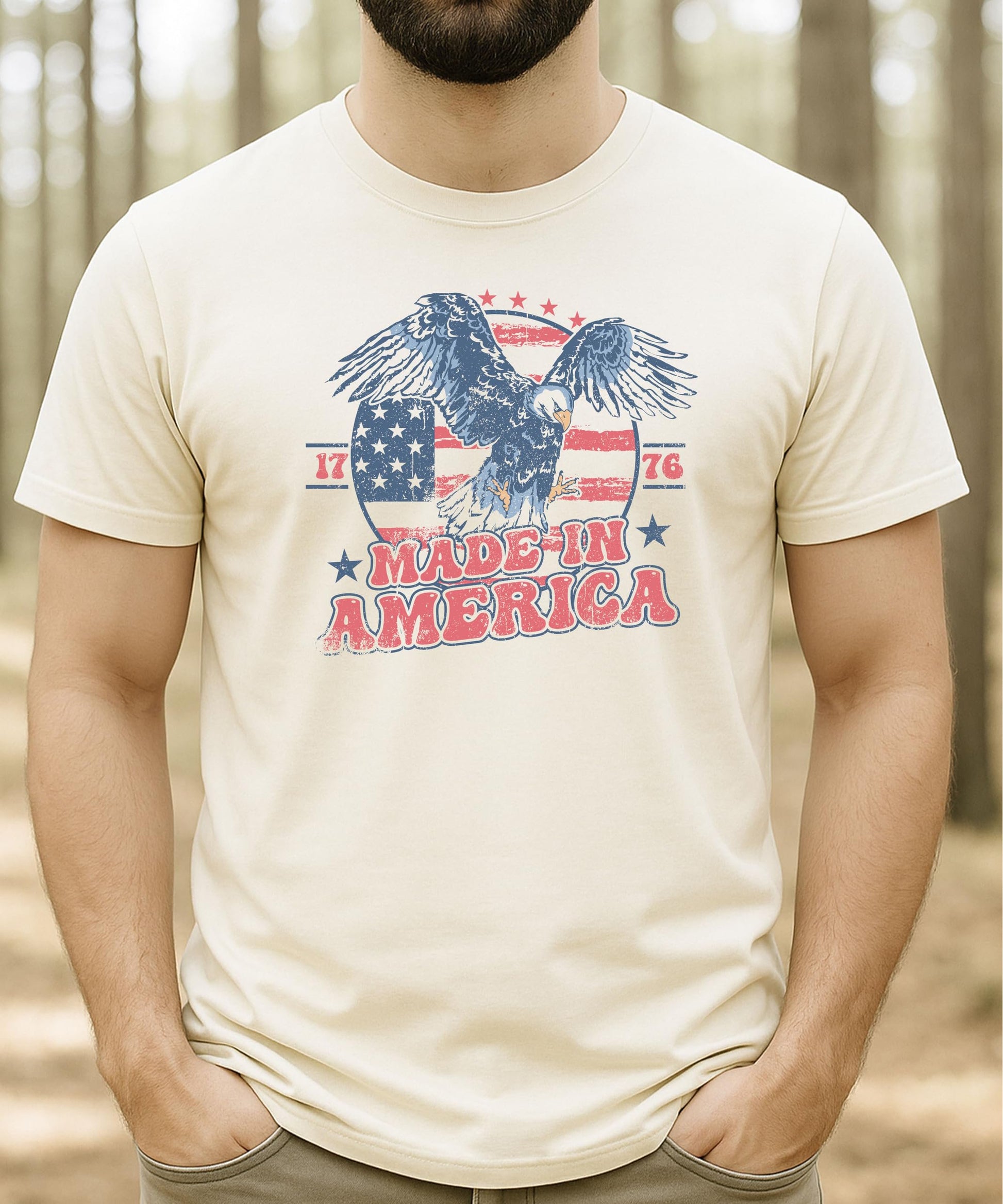 Group flat lay of family matching Made In America patriotic tees in multiple sizes