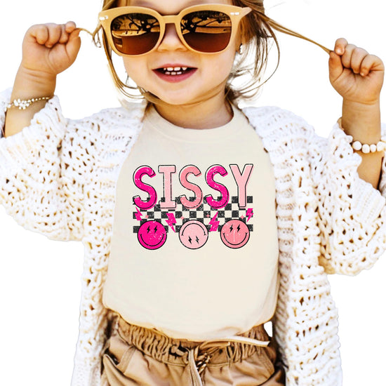 Detail shot of professional print quality on pink Sissy graphic tee for girls