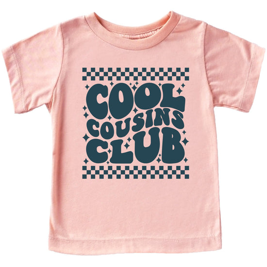 Close-up of Cool Cousins Club vintage-style graphic print on peach t-shirt