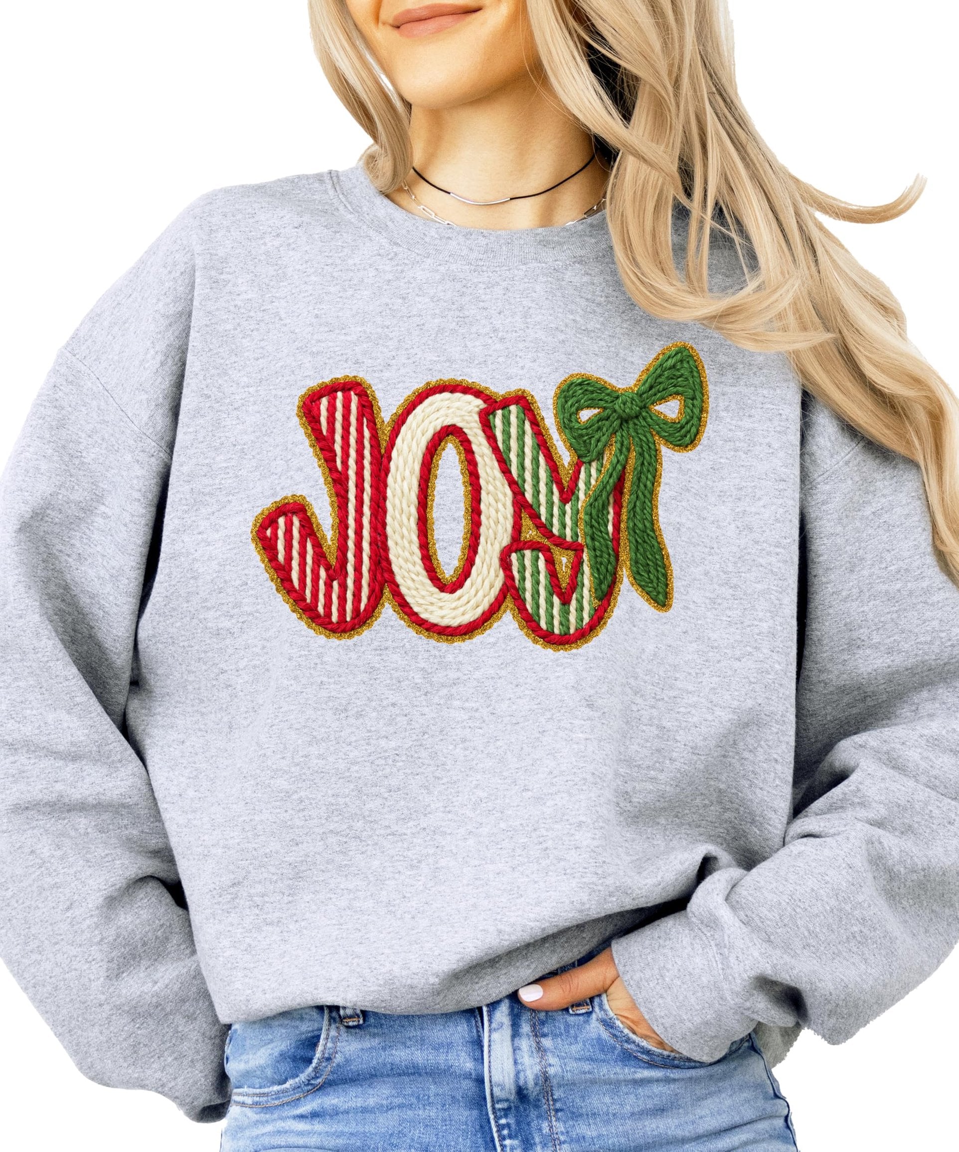 Front view of women's Christmas pullover sweatshirt with JOY graphic in holiday red and green