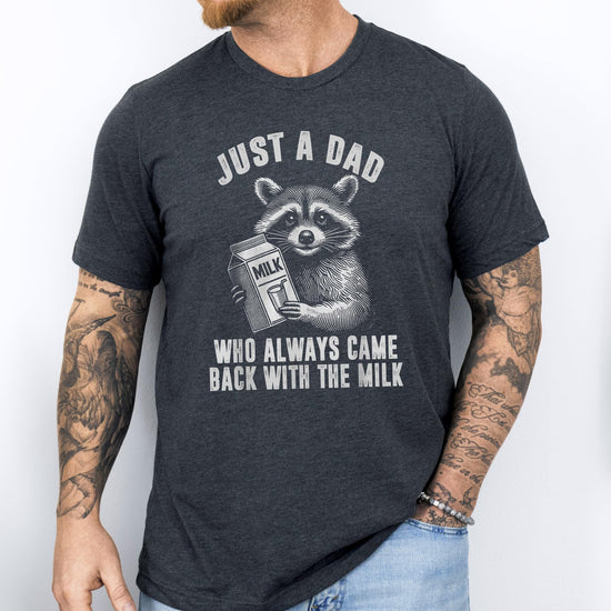 Flat lay of men's dark gray graphic tee with humorous raccoon dad design