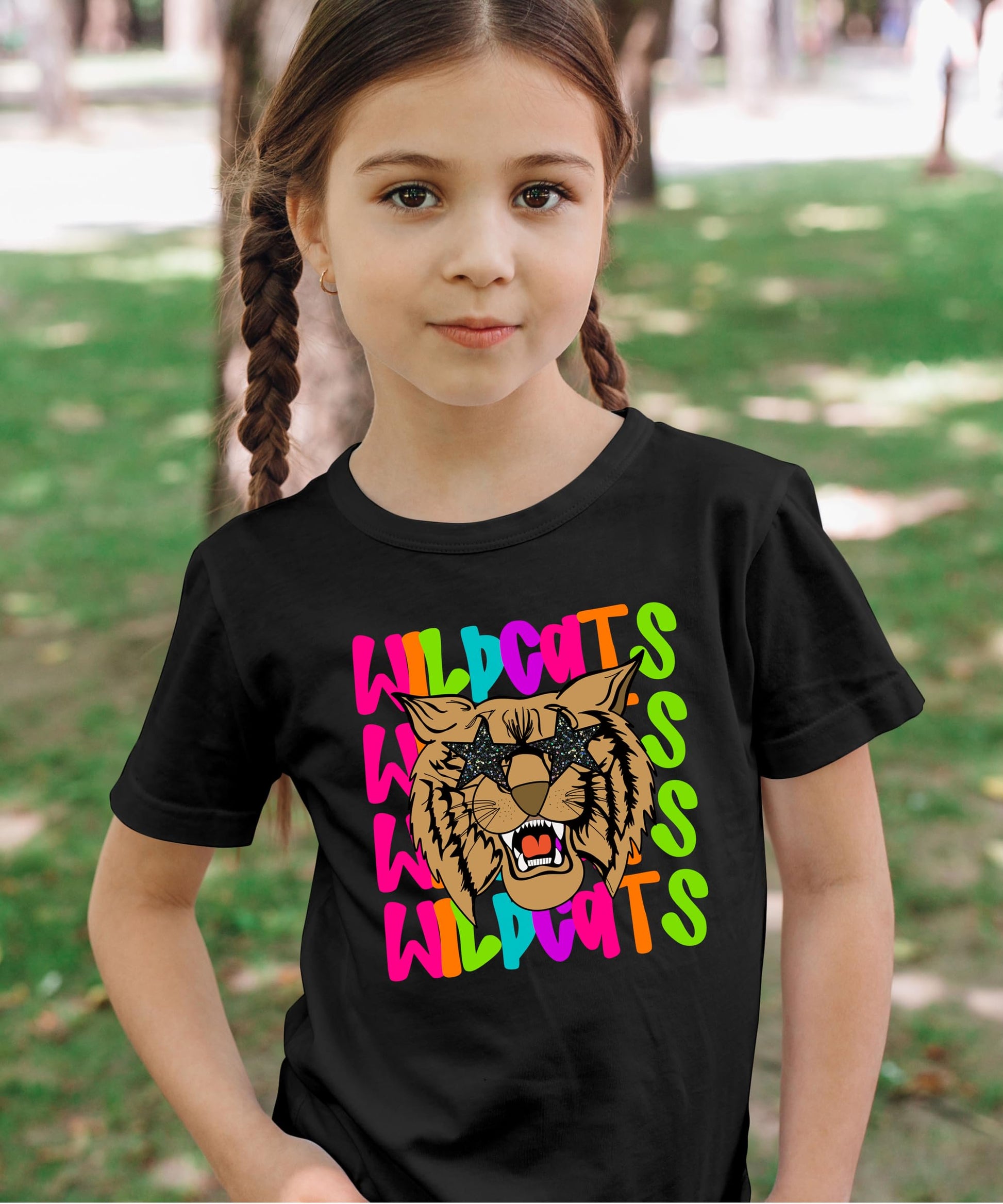 Detail view of wildcats mascot print with neon colors and star elements