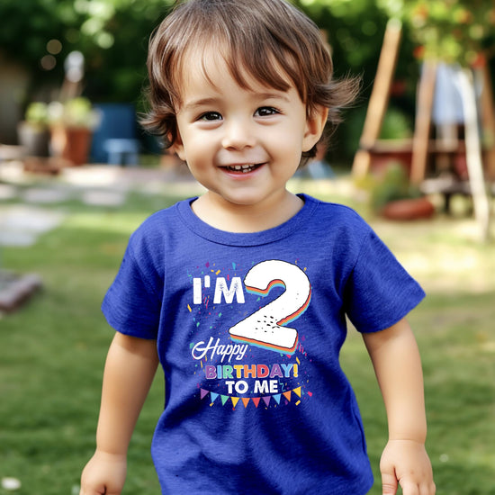 Lifestyle photo of toddler in 'I'm 2' birthday shirt perfect for birthday party or cake smash photos