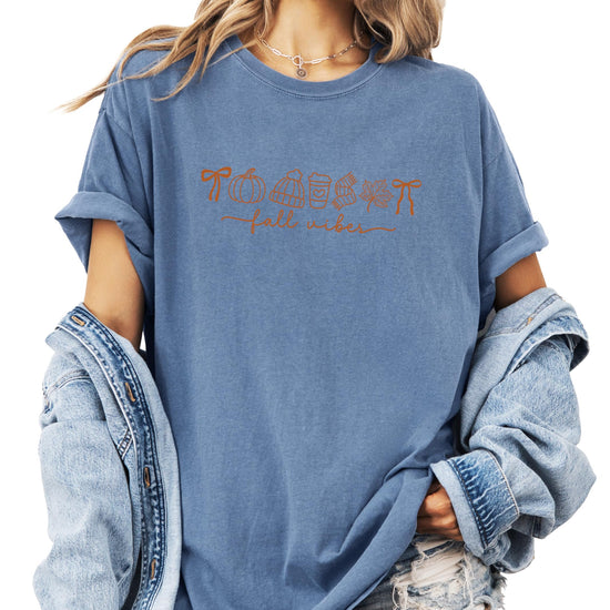 Fall Vibes graphic t-shirt in ivory featuring pumpkin coffee and leaf design on female model