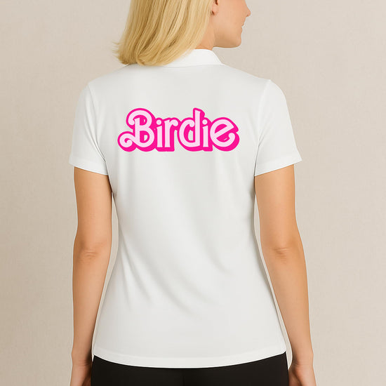 Woman modeling pink retro golf polo in country club setting with preppy styling