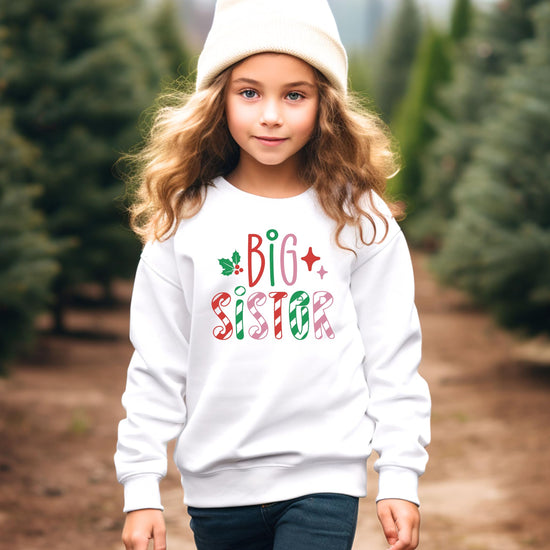 Big Sister Christmas sweatshirt displayed flat, showing full graphic print on white youth sweatshirt