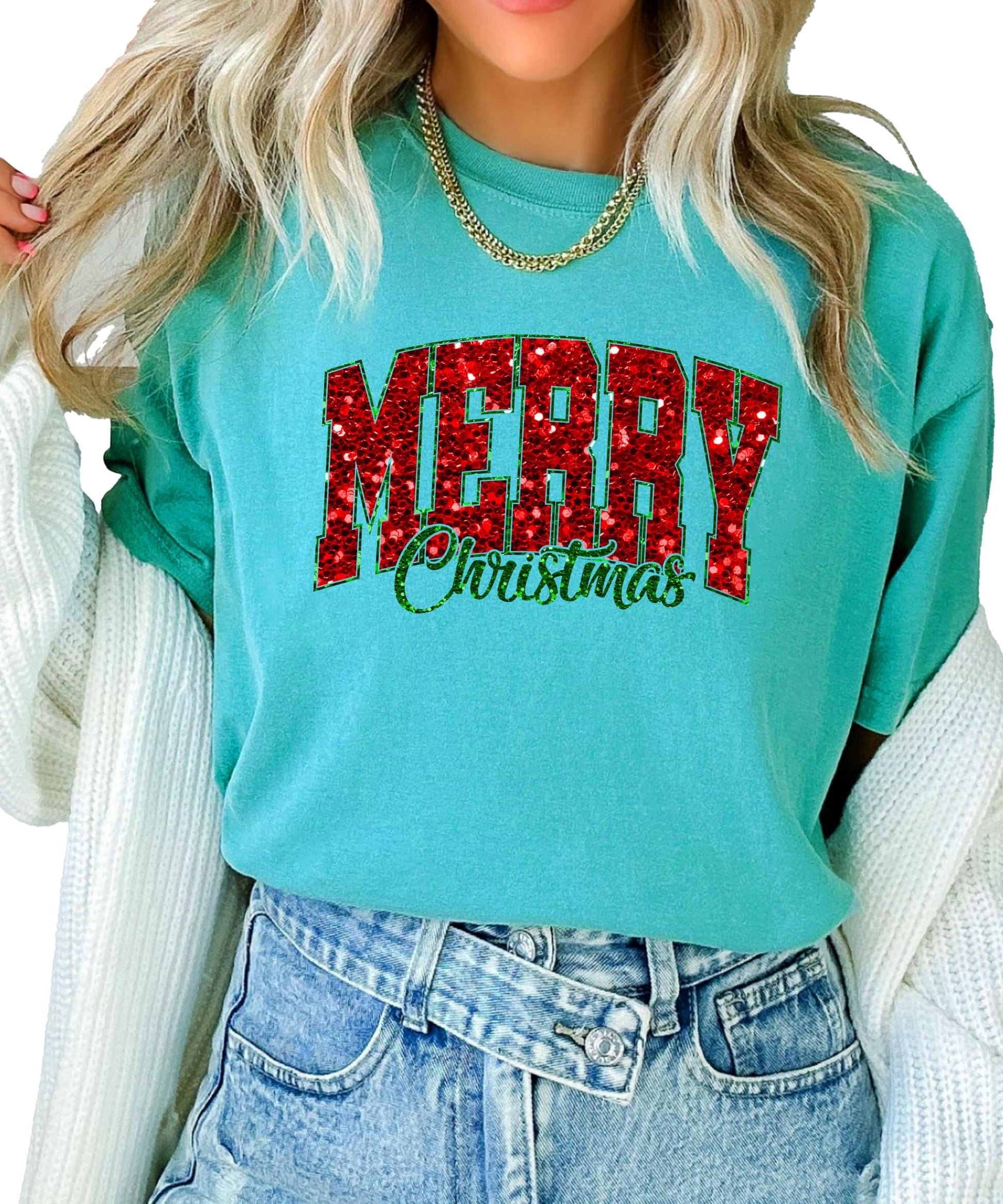 Flat lay of seafoam Merry Christmas faux glitter tee showing full graphic design