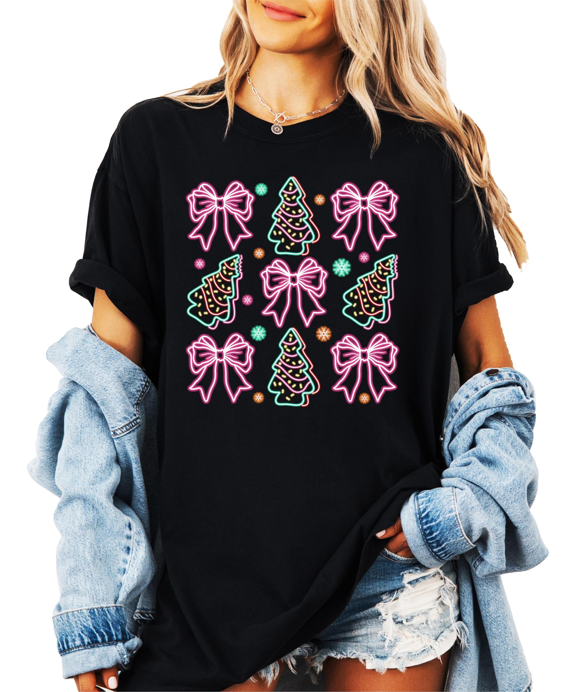 Front view of neon Christmas trees and gift bows graphic tee on black shirt for women and teens