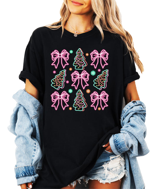 Front view of neon Christmas trees and gift bows graphic tee on black shirt for women and teens