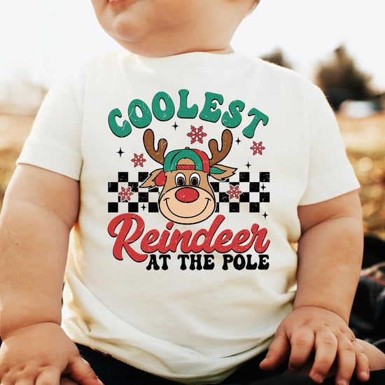 Kids Christmas reindeer shirt detail shot showing vibrant USA-printed graphic on natural tee