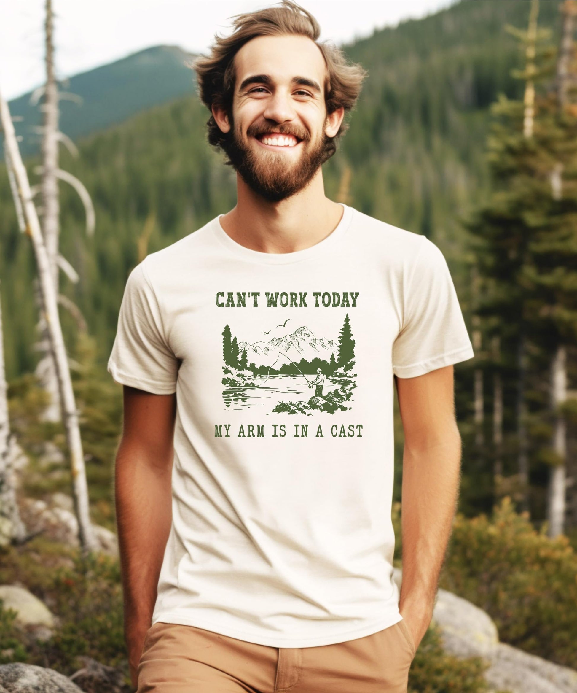 Close-up of 'Can't Work Today My Arm is in a Cast' funny fishing design printed on natural cotton tee
