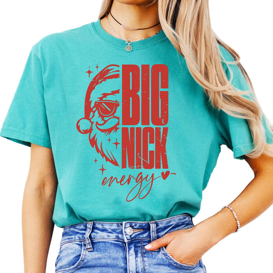 Women wearing Big Nick Energy funny Christmas tee with bold Santa sunglasses design