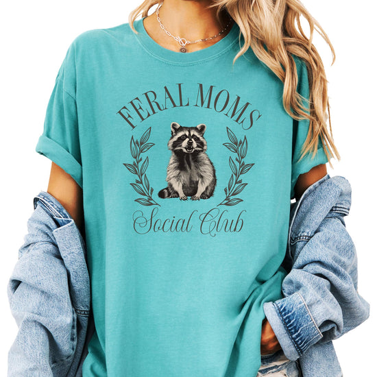 Front view of women's Feral Moms Social Club funny raccoon tee in ivory